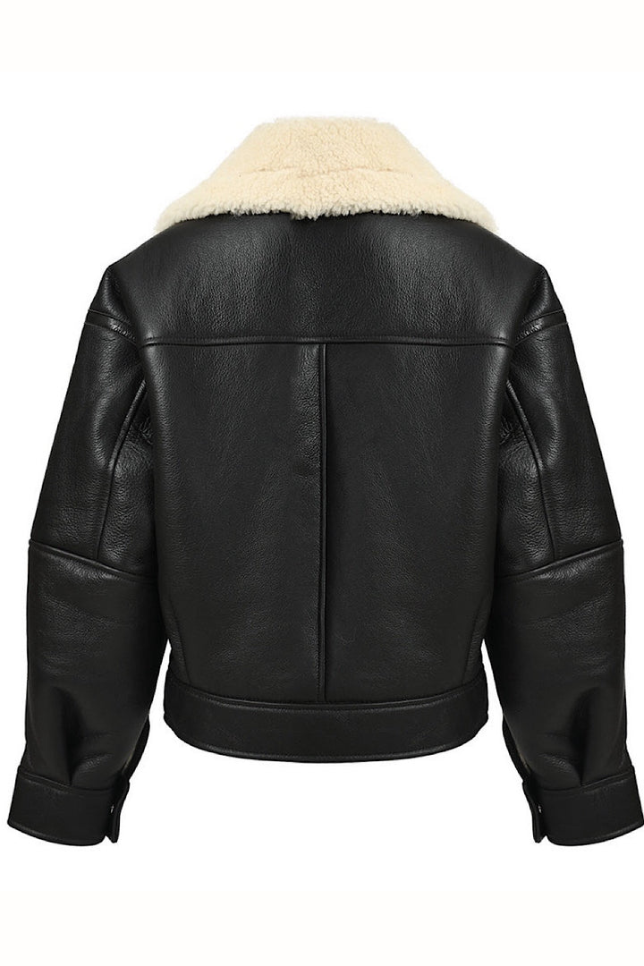 Black sheepskin aviator leather bomber with plush shearling lining, designed in a cropped voluminous style that offers both warmth and a trendy sporty look.